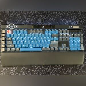 Corsair K100 RGB Keyboard with Blue/Black TAI HAO keycaps. Corsair OPX Switches.